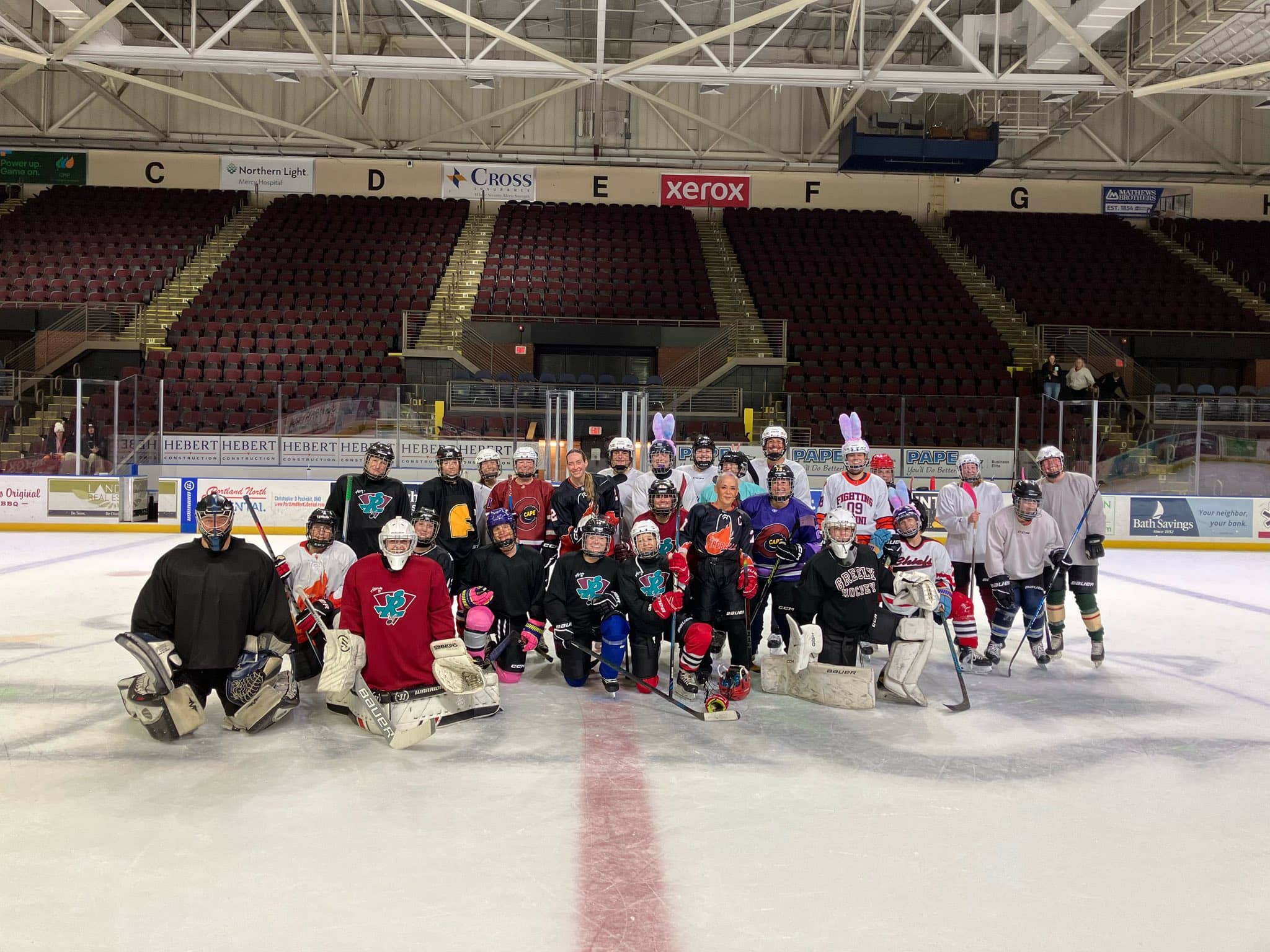 Maine Chill players and friends together on the ice