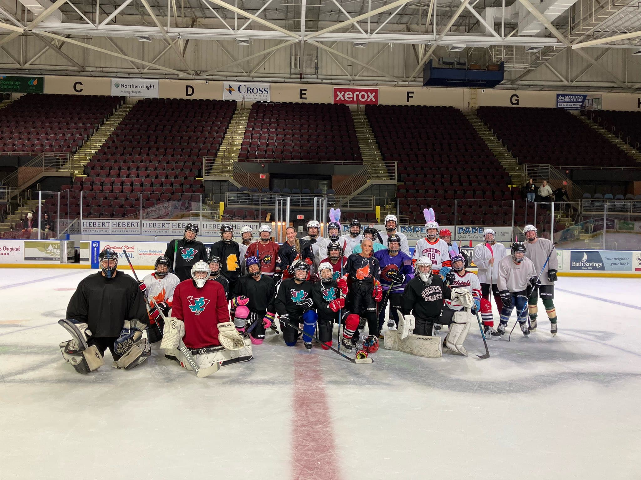 Maine Chill players and friends together on the ice